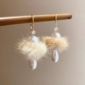 Macro shot of elegant earrings with beige pom poms and teardrop pearl drops on wood - Silver Pin Hook Style / Brown