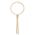 Collier chic en chaîne serpent dorée avec un nœud élégant et deux pompons - Doré