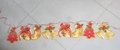 Christmas paper bunting featuring festive stars, socks, and gift boxes on a red string - 2.5m Bells & Boots