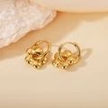 Polished gold flower drop earrings on a silk background with white stone accents - Plum Blossom Pendant / Gold