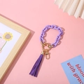 Fashionable purple acrylic keychain with chunky chain and golden ring on pink background - Purple