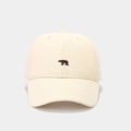 Detail of minimalist cream cotton baseball cap featuring a small brown bear embroidery - Adjustable / Beige