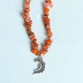 Irregular red crystal stone necklace featuring a silver moon-shaped feather pendant - Red Agate Moon