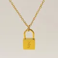 Golden padlock necklace featuring a minimalist engraved Gothic letter F charm - Letter F Style