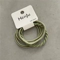 Close-up of green elastic hair band set with twisted and smooth textures on card - Light Green (4Pcs) Card Packed