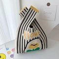 Striped beige knit bucket bag with yellow flow lettering and floral pattern - Black Rice Stripe Flower