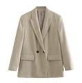 Detail of double-breasted beige blazer featuring peak lapels and symmetrical flap pockets - XS / Khaki