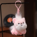 Rosa und weißer Plüsch-Pony-Anhänger mit passendem Schlüsselband auf weichem Hintergrund - Rosa