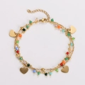 Detail view of a double-layered gold bracelet with colorful beads and heart charms - Small Heart