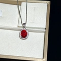 Silver necklace featuring oval red gemstone pendant with white diamond halo in a jewelry box - White Gold Oval Red Diamond Necklace Xl-121 [with Cross Chain]