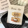Set di due fermagli per capelli dorati con fiocco di paillettes e foglia oro - Foglia + Pizzo