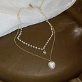 Dettaglio collana a due strati con ciondolo a cuore in madreperla e fili di perle - 28# Collana-Oro-Cuore