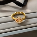 Macro shot of gold chain ring with inlaid cubic zirconia on a luxury display box - Anchor Link Ring (RF588) / Gold