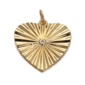 Detailed close-up of golden heart pendant with radial texture and central gemstone - CX138-12 Heart Sunburst Grain Zirconia Pendant