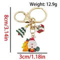 Golden Christmas keychain with Santa Claus, Xmas tree, and red gift box enamel charms - ER1801-Tree Gift Box Santa 8-shape Keychain