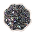 Pile of 5mm colorful iridescent square glass sugar beads in a white ceramic petal bowl - Black