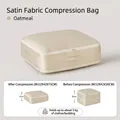 Oatmeal satin fabric compression storage bag M size showing height reduction after use - Down Compression Storage Bag - Medium Beige