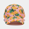 Close-up of pink baseball cap featuring tropical banana print and palm leaf pattern - Pink All-over Banana Style