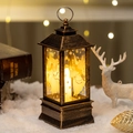 Bronze Christmas lantern with angel design and LED candle in cozy winter snow scene - Angel / Bronze