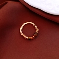Detail of 18K gold-plated beaded ring with tiger eye stones on red silk fabric - Gold-Brown Tiger Eye