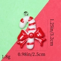 Detail of candy cane resin pendant with red bow, measuring 3.2cm in height and 2.5cm in width - 42# Glitter Candy Cane