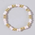 Pink pearl-style beads mixed with gold metallic spacers on a stretch ring - Pink and Gold