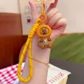 Cute brown capybara plush keychain with yellow braided lanyard and baking theme detail - Lieba Bread PVC Hat