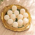 Set of 12 cream white 6cm flocked Christmas baubles on a gold mirror tray for tree decor - Cream
