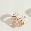 Macro view of French vintage style enamel striped hoop earrings in 14K gold plating - Colorful