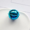 Single blue star-shaped metal bell with cutout star patterns on white ceramic tray - 25mm / Lake Blue