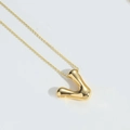 Luxurious gold-plated V-letter pendant necklace with a polished mirror finish on white - Letter V