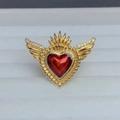 Macro shot of gold-plated heart ring with wings, red enamel, and zircon details - Vintage Large Winged Style (G)
