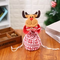3D reindeer knit drawstring Christmas gift bag with festive red and white snowflake pattern - Knitted Reindeer Bag