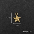 Detail view of a 1.5cm golden starfish pendant with dimensions and weight 1.4g - Starfish 3