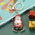 Sparkly Santa Claus keychain with red rhinestones and 925 stamp on festive background - Santa Claus