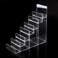 Six-tier clear acrylic tiered display stand for wallets and small items on black background - 7-Tier / Clear