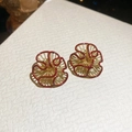 Macro shot of vintage gold flower earrings with deep red enamel and intricate woven texture - Golden Hollow Fan Flower Style (2#)