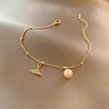 Elegant gold chain bracelet featuring white pearl and sparkling pavé zircon fishtail charm - New Gold Mfd002 Bracelet
