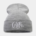 Detailed view of the Gigi embroidery on a soft light grey knitted beanie cap - One Size / Light Gray