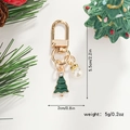 Detailed view of enamel Christmas tree keychain with dimensions 5.5cm by 2.0cm and 5g weight - Christmas Tree