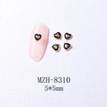 Close-up of 5x5mm heart nail charms with gold borders and black enamel finish - 8310 Gold Border Black Heart (5*5mm)