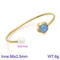 Golden open bangle featuring shell pearl and blue flower charm with 56mm inner diameter - Gold Blue Evil Eye Style (KB123097-K)