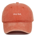 Macro view of white dog dad embroidery on vintage washed orange cotton baseball cap - Adjustable / Orange