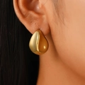Polished golden oversized teardrop earrings featuring a minimalist bold waterdrop design - 18K Gold Concave Drop