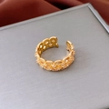 Detail of 18k gold plated open ring featuring hollow geometric patterns and tiny zircons - Gold