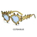 Gafas de sol con montura ondulada color té y cristales azul claro de diseño moderno - Marco Té Transparente Lente Azul