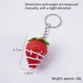 Artificial strawberry keychain in bright red with white sauce lines and green leaves - Red Jam - Red Strawberry (Keychain)