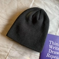 Classic black knitted beanie hat with ribbed texture for winter warmth and street style - Elastic / Black