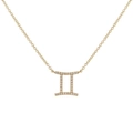 Detailed view of a gold Gemini zodiac necklace set with shimmering pavé zircon stones - Gold Gemini