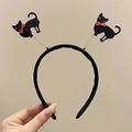 Halloween headband featuring cute black cats with red bows on spring coils - Cat